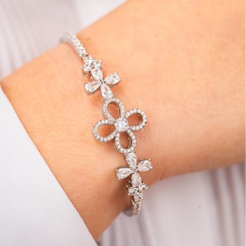 Bracciale semi rigido con motivo floreale centrale definito da un doppio fiore di zirconi e fiore centrale crystal Mod.XB1049