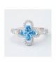 Anello con motivo floreale definito da zirconi e fiore centrale acquamarina mod. xan224a [70c5d662]